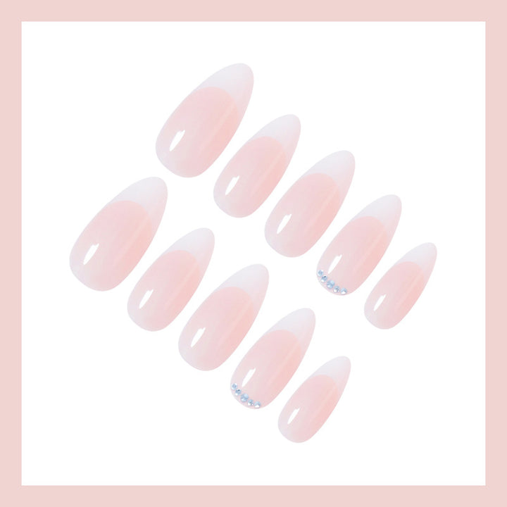 Artificial nail set with elegant French tip look and shimmering accents Kalsten
