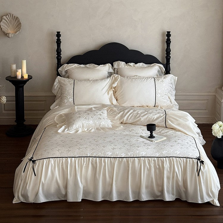 Jacquard bedding set with ruffle, decorative ribbons and fine piping