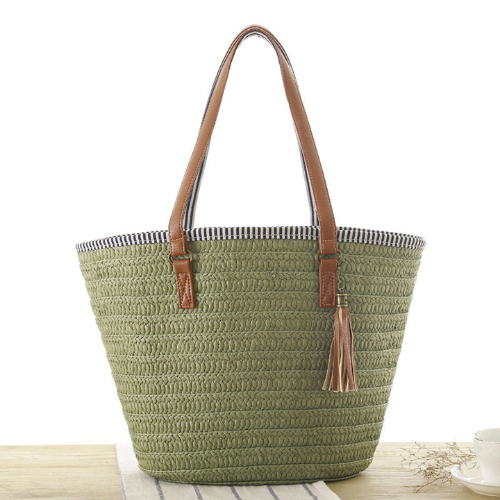Beach bag made of hand-woven natural material with elegant leather accent Kalsten