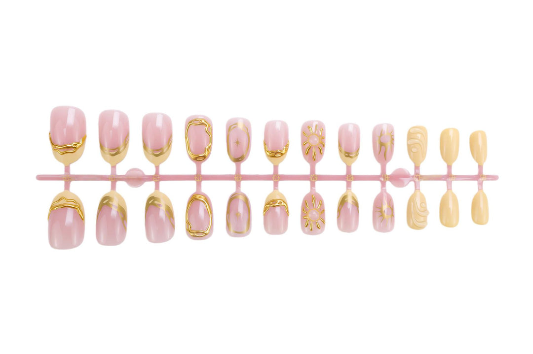 Acrylic nail set with elegant gold embellishments and creative designs Kalsten