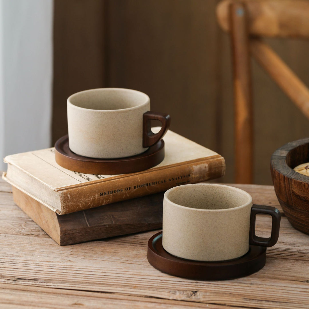 Ceramic mug with wooden handle and saucer