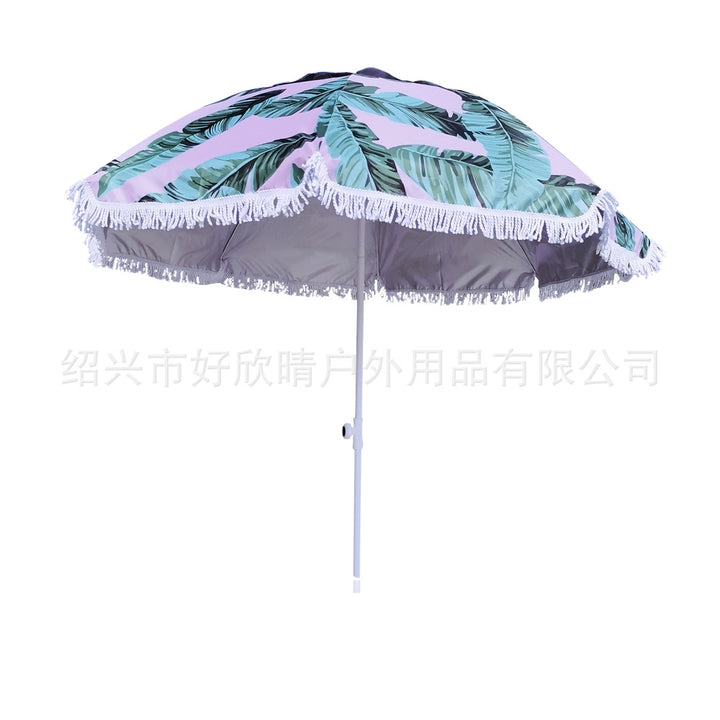 Ladies sun umbrella with tropical leaf design and tassel decoration Kalsten