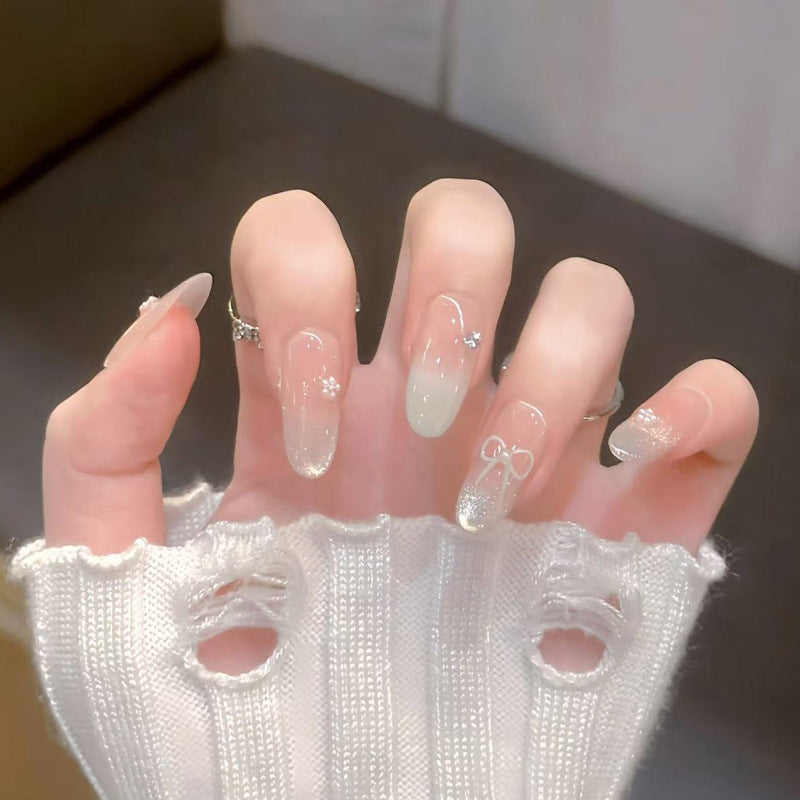 Decorative Press-On Nail Art with Bow and Gem Accents Kalsten