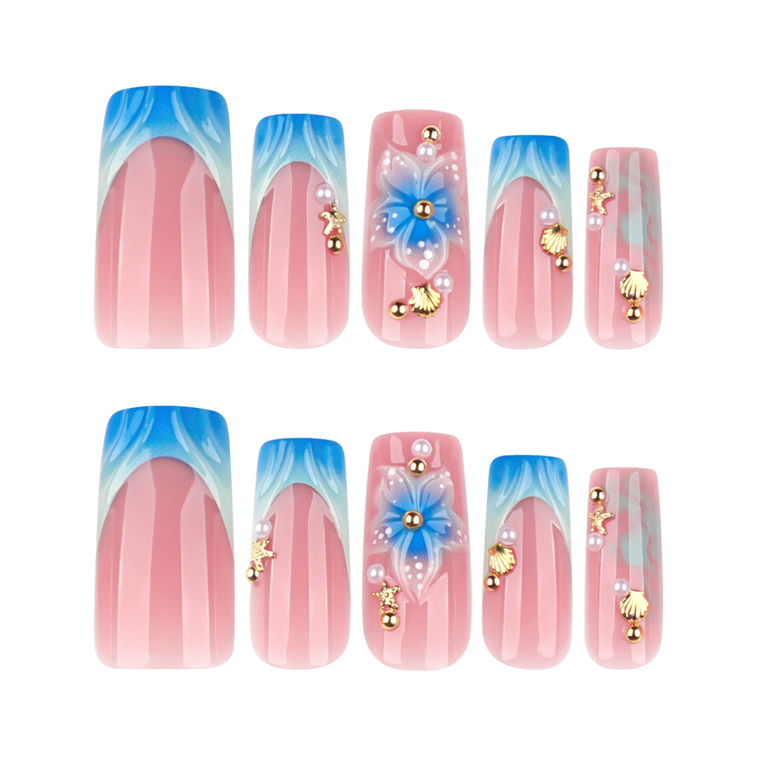 Artful nail art with floral accents and glitter effects Kalsten