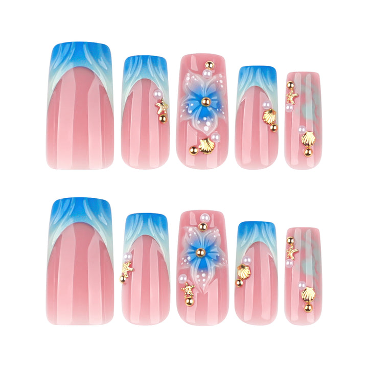 Artful nail art with floral accents and glitter effects Kalsten