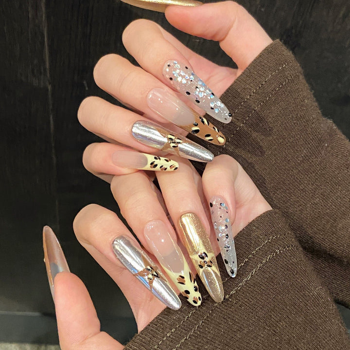 Artistic Press-On Nail Design Set with Metallic and Glitter Accents