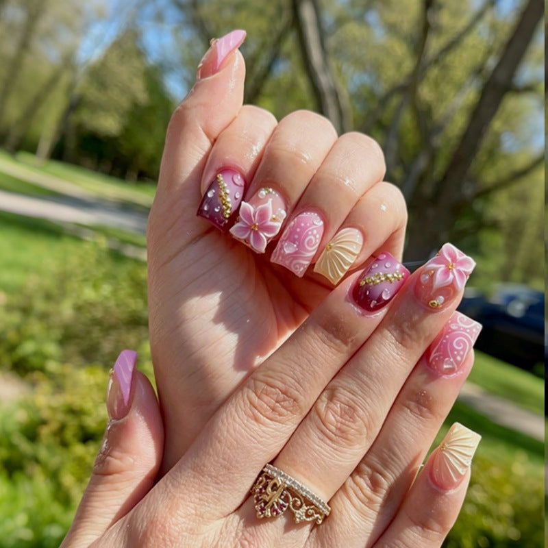 Artificial nail collection with floral design and glitter accents Kalsten