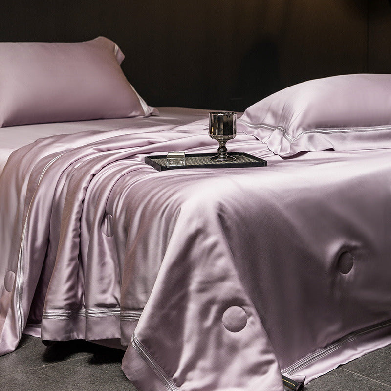 Luxurious satin bed set with silk-like surface and fine decorative stitching