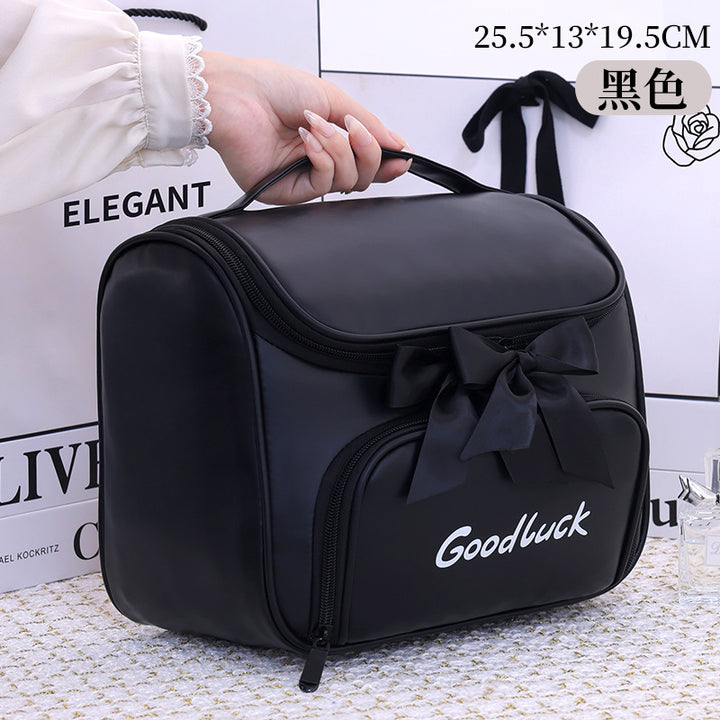 Cosmetic and toiletry bag with elegant bow accent Kalsten