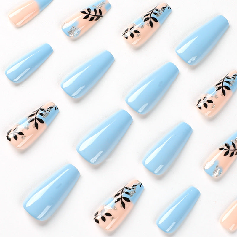 Artful Nail Art with Floral Designs and Glitter Kalsten