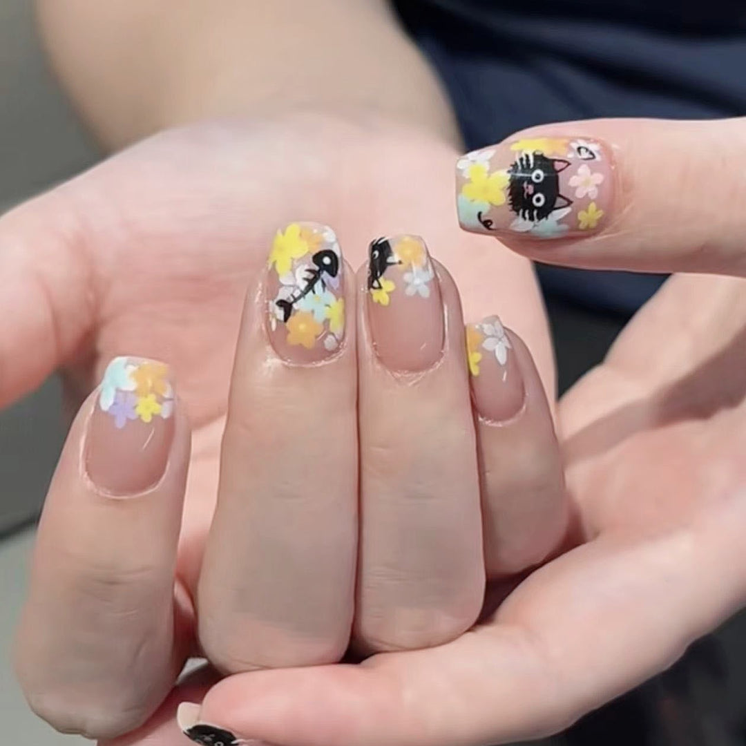 Artistic Heart-Embellished Stiletto Nails