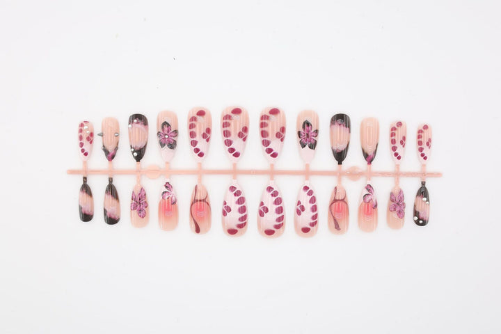 Acrylic nail set with elegant floral design and glossy accents Kalsten
