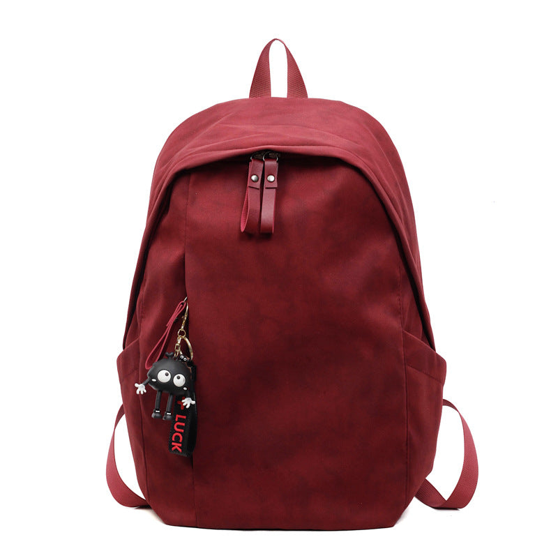 Fashionable backpack with practical design and decorative pendant Kalsten