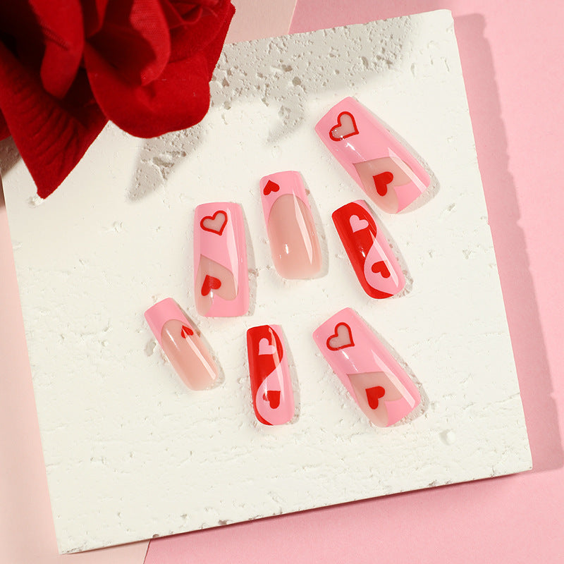 Artificial nail art with heart design and glitter accents Kalsten