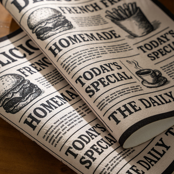 Coir doormat in newspaper layout with non-slip backing Kalsten