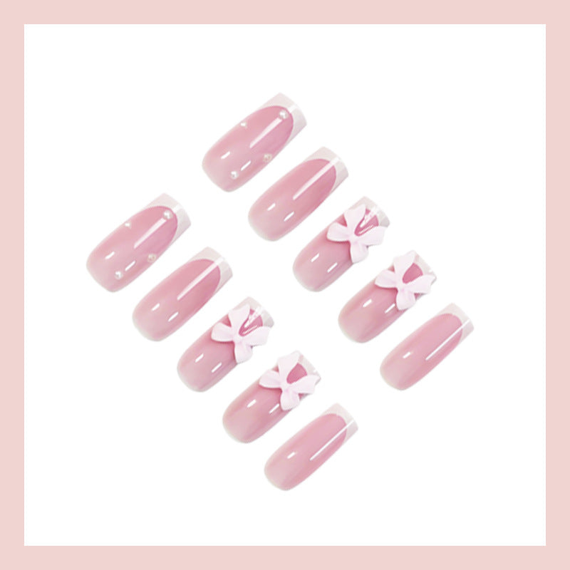 Glamorous artificial nail set with elegant bows and glitter accents Kalsten