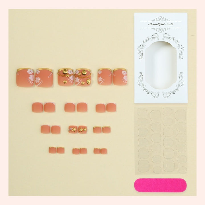 Acrylic nail set with exquisite floral accents and golden embellishments Kalsten