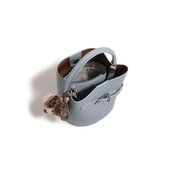 Chic Pebbled Leather Handbag with Cute Charm