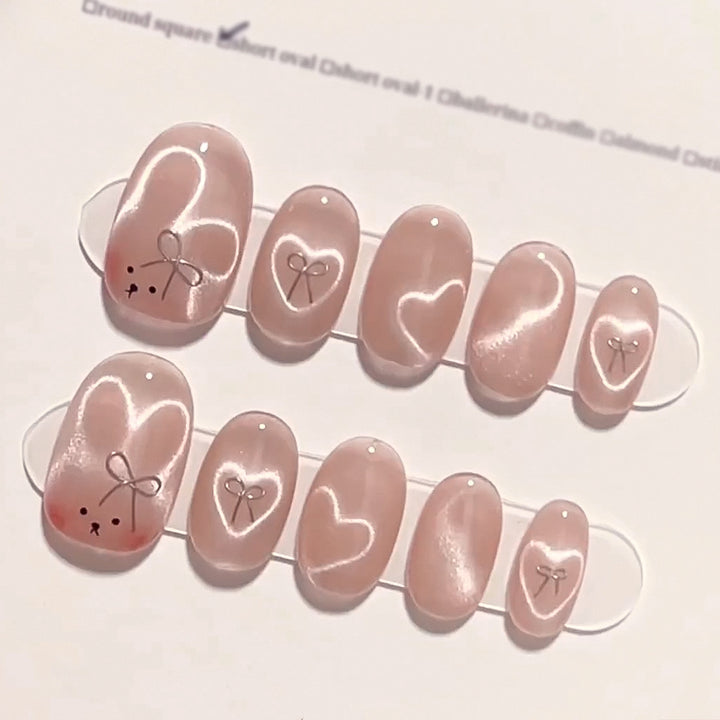 Artificial nail extensions with cute bunny design and hearts Kalsten