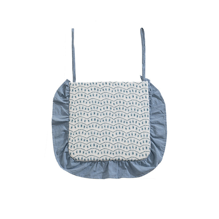 Padded chair cushion with ties, ruffled edge and embroidered hole pattern look Kalsten