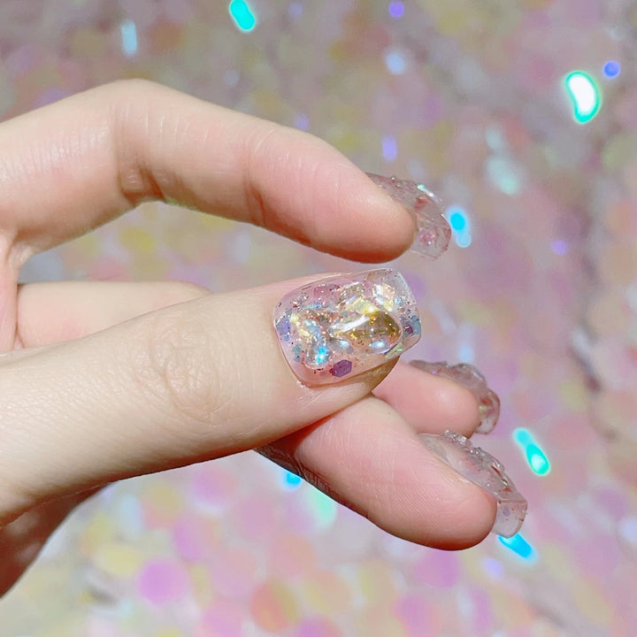 Artful nail tips with glitter accents Kalsten