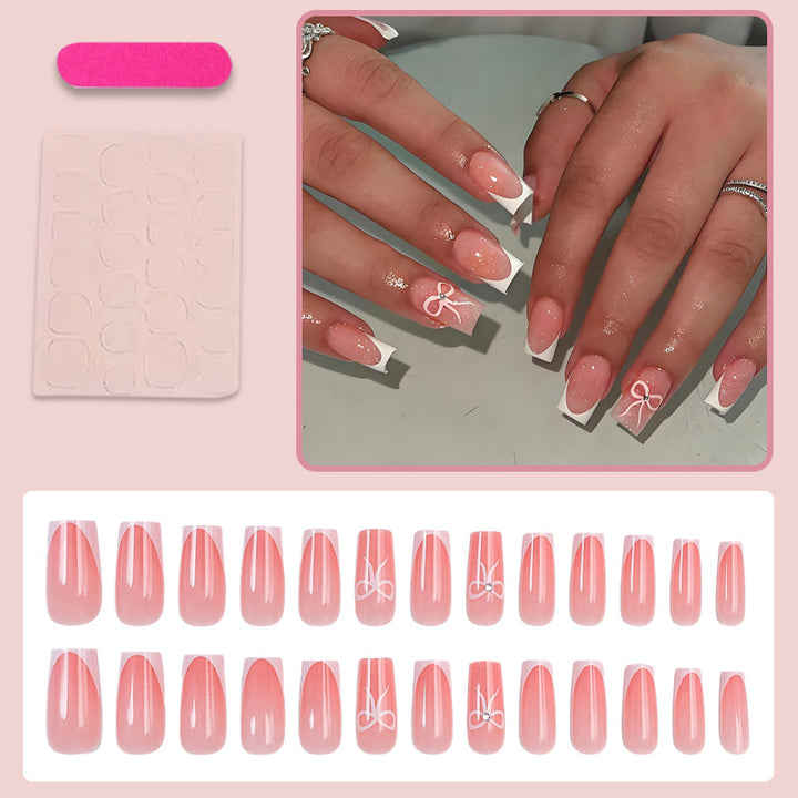 Artificial nail set with elegant tips and delicate bow motifs Kalsten