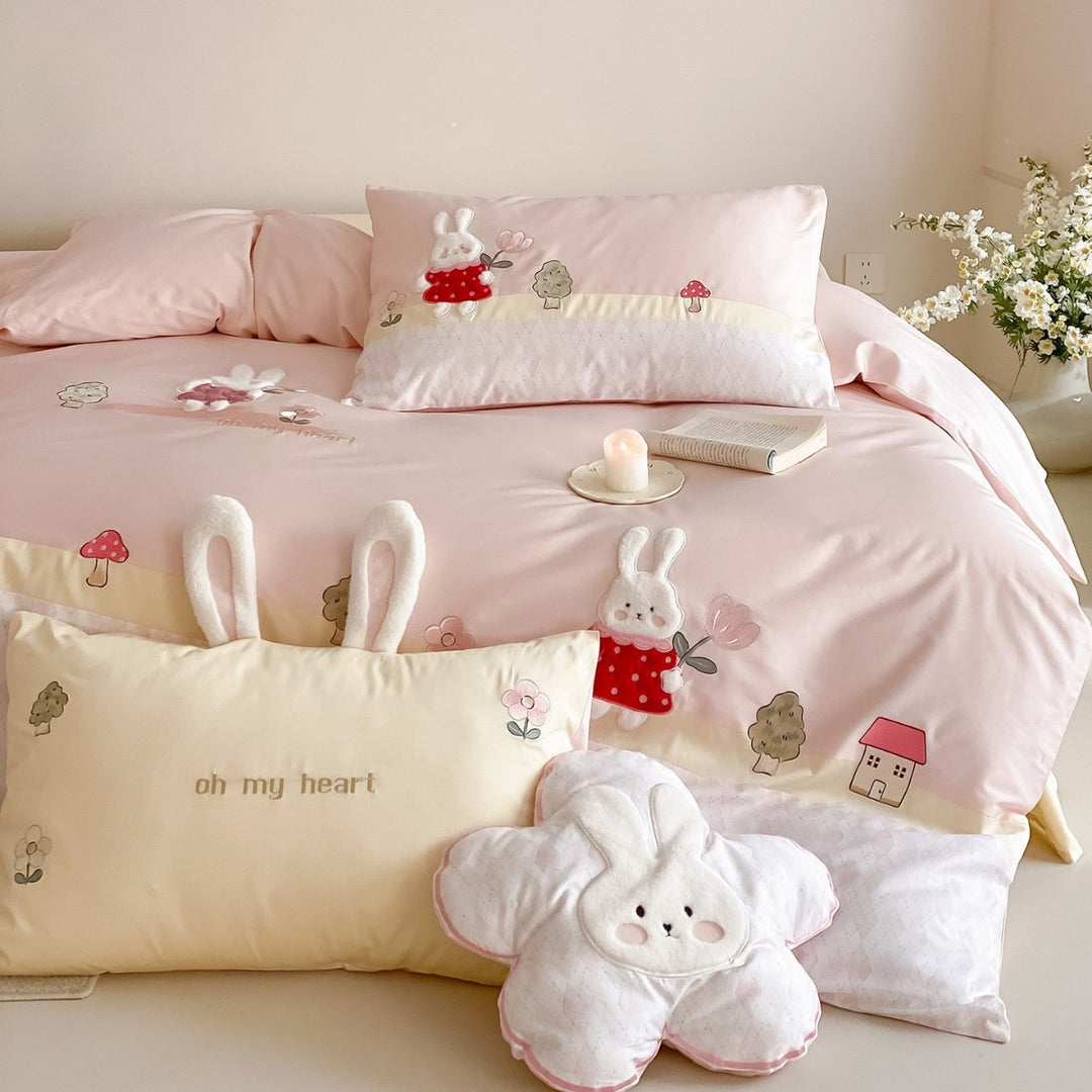 Playful cotton satin bed linen set with embroidered bunny appliqués and plush pillow