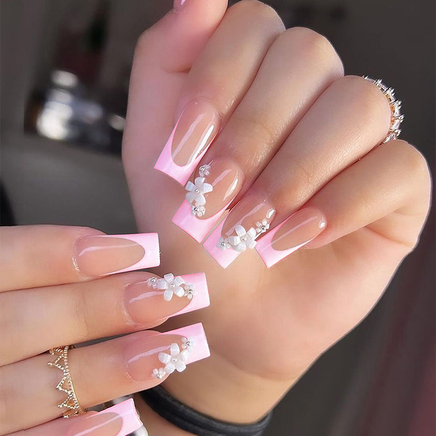Artificial nail set with elegant French tips and hand-drawn flower motifs Kalsten