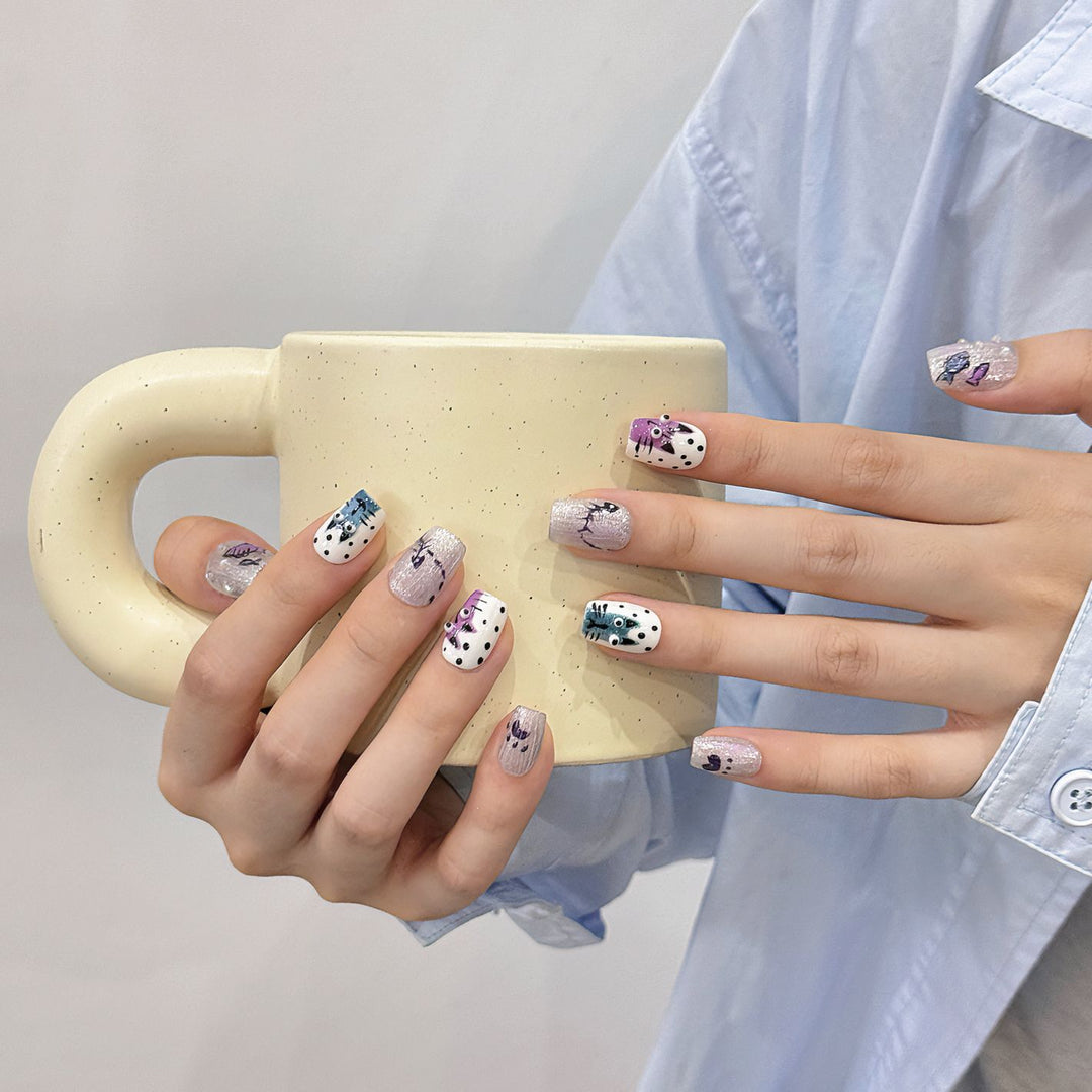 Artistic Press-On Nail Art Set with Unique Whimsical Designs
