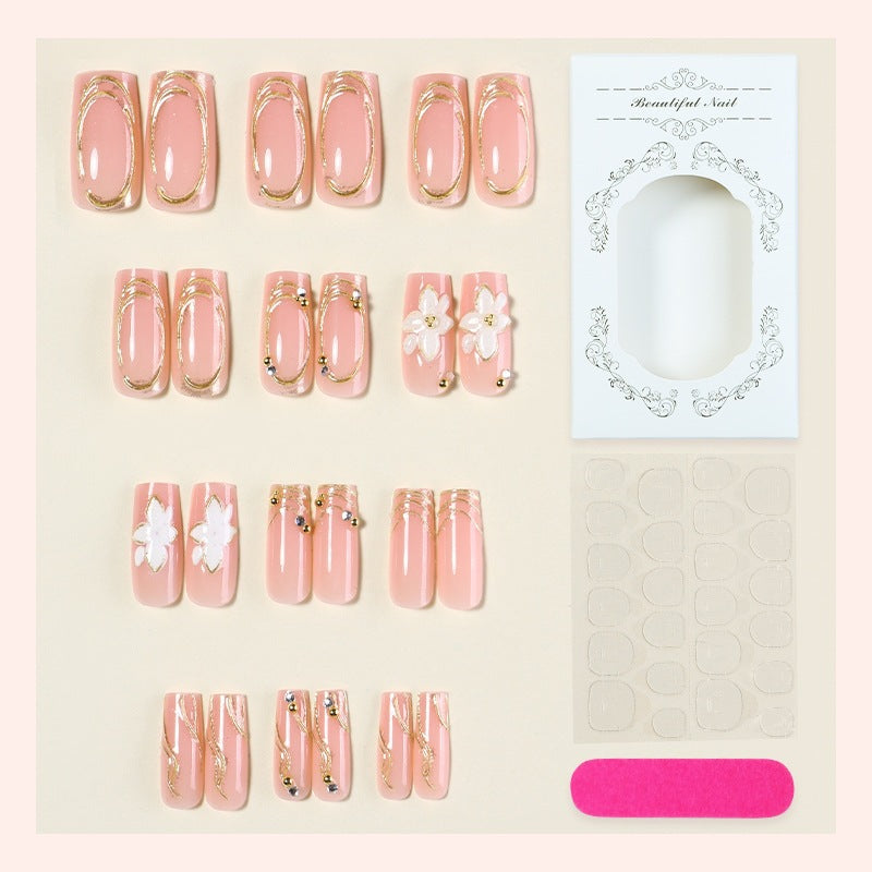 Elegant artificial nail set with decorative flower and gold embellishments Kalsten
