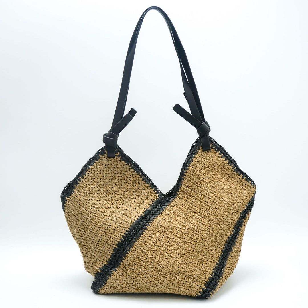 Fashionable beach bag made of woven natural material with leather handles Kalsten