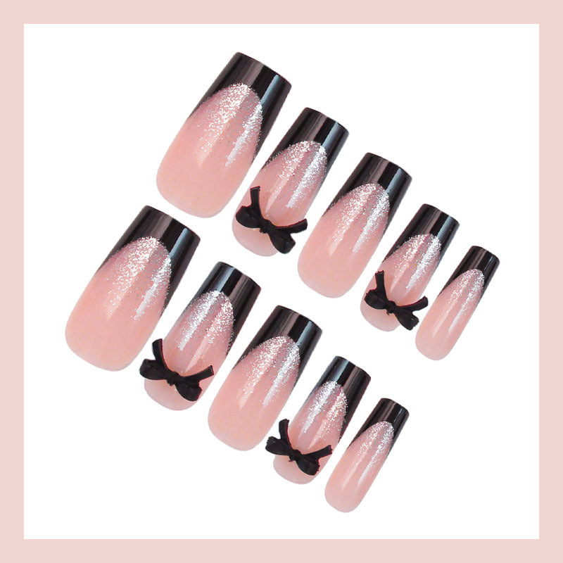 Artificial nail set with elegant glitter accents and bow details Kalsten