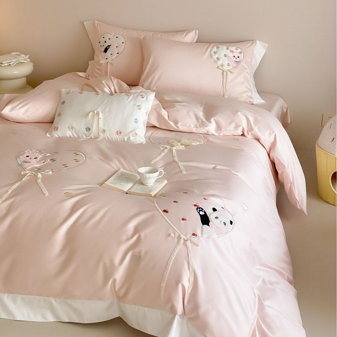 Romantic cotton bedding set with appliquéd heart balloons and plush motifs