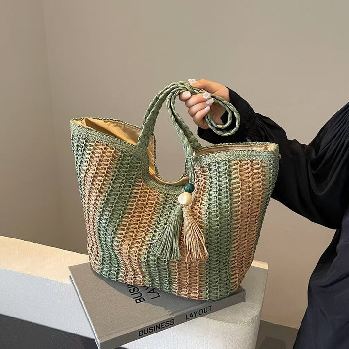 Handcrafted straw bag with elegant tassels and detailed texture Kalsten