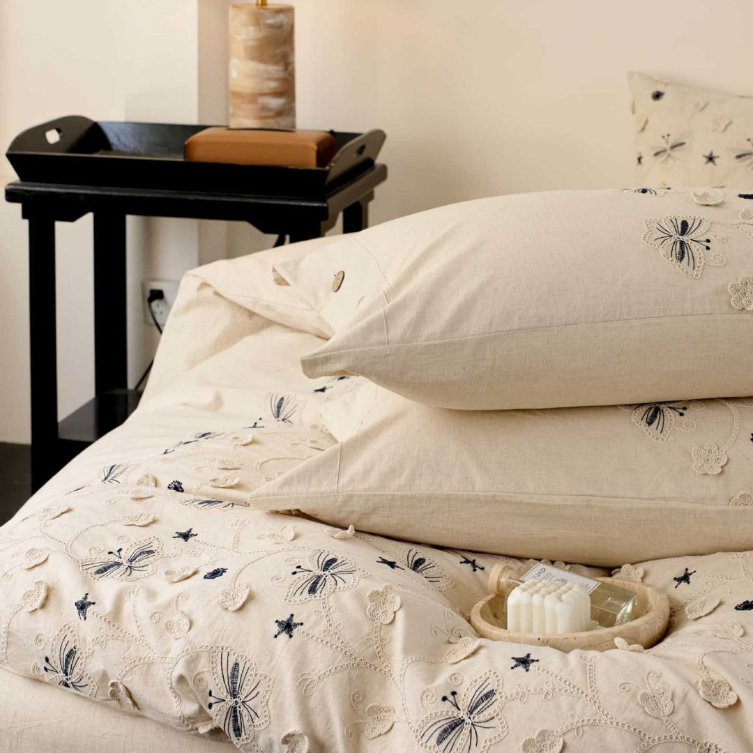 Embroidered cotton bedding set with wooden buttons and butterfly appliqués