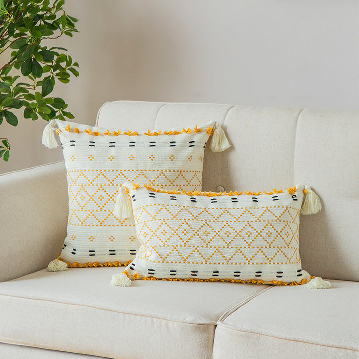 Square decorative cushion cover made of cotton blend with hand-tufted geometric relief and tassels
