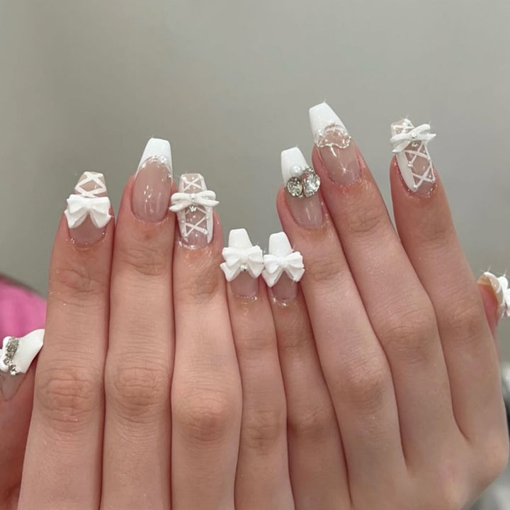 Artful Nail Art with Bows and Rhinestone Decorations Kalsten