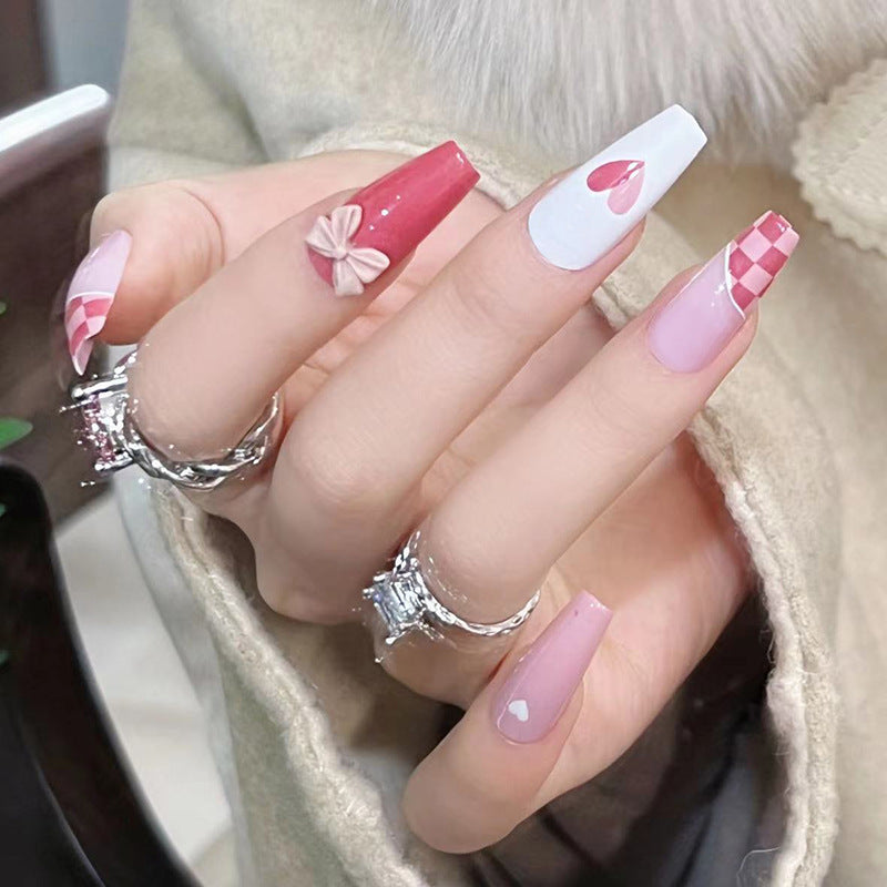 Artful nail extensions with playful designs and romantic accents Kalsten