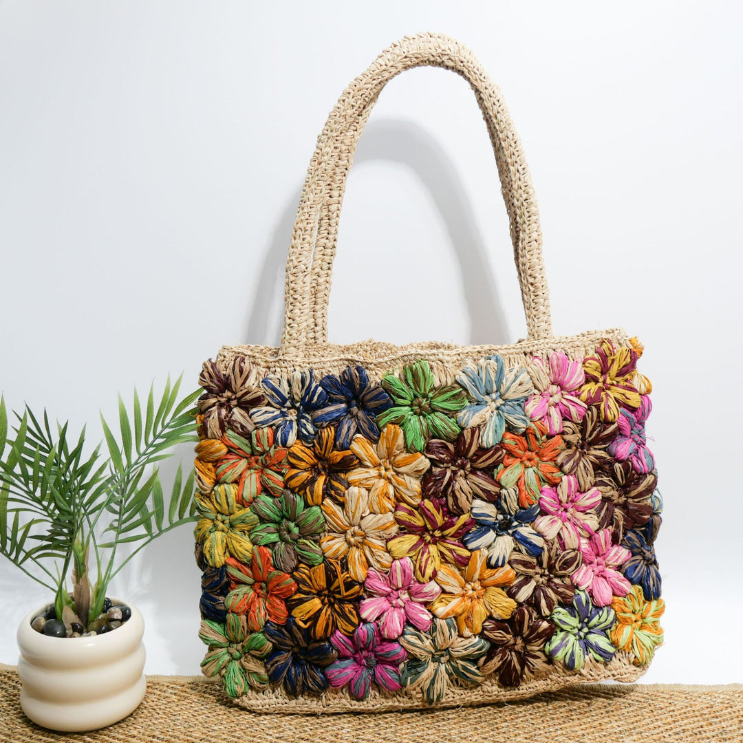 Handcrafted straw bag with floral appliqués Kalsten