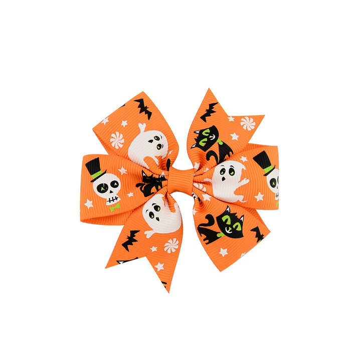 Halloween bow with pumpkin and witch motifs