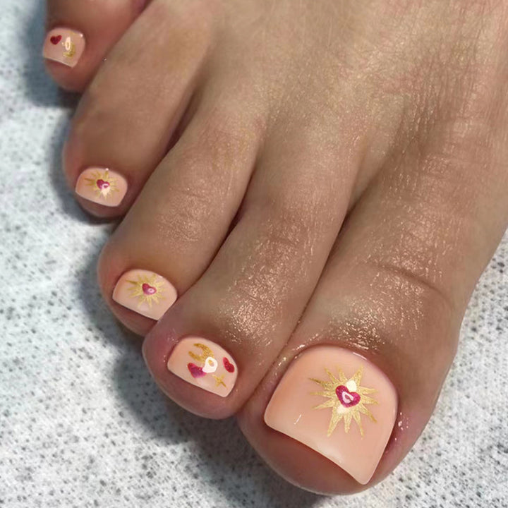 Artistic toenail art with heart and flower design Kalsten