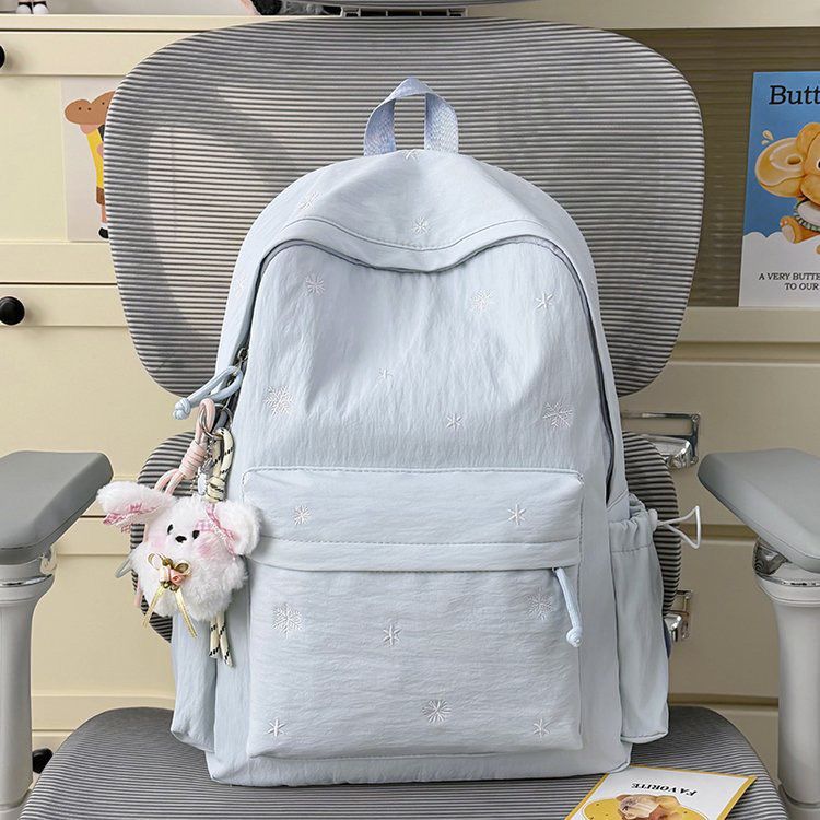 Playful backpack with fine embroidery Kalsten