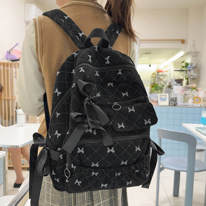 Playful backpack with bow details and practical compartments Kalsten
