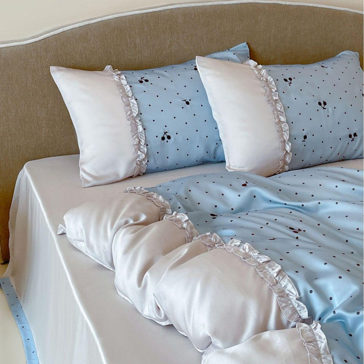 Satin bedding set with delicate ruffles and cherry pattern
