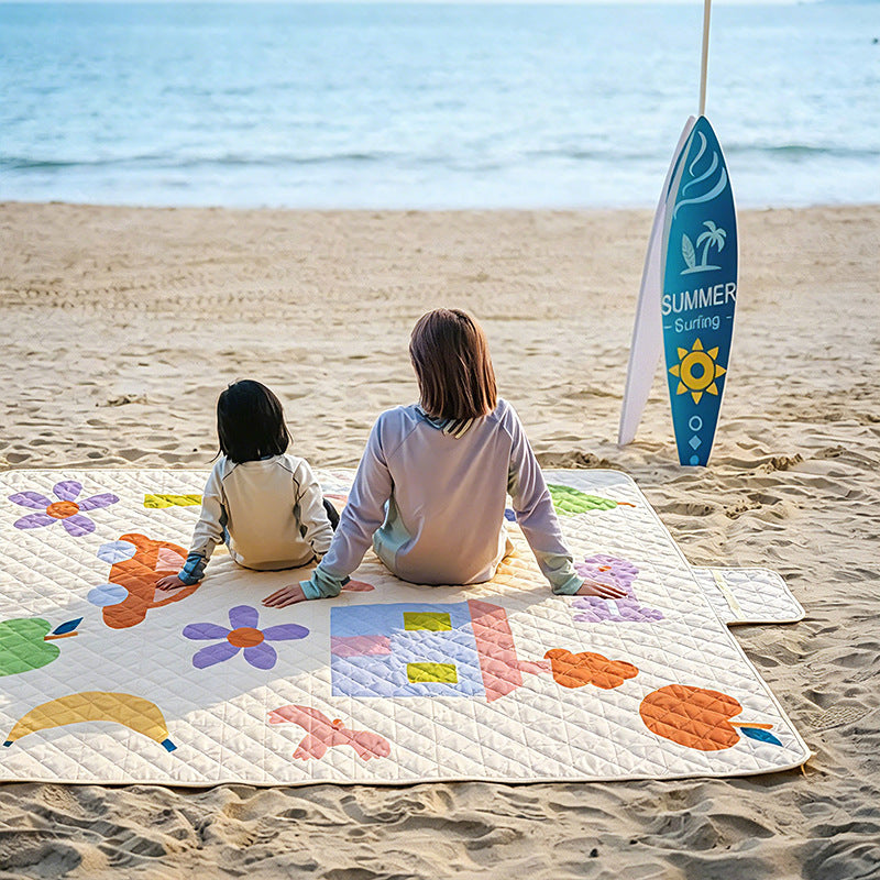 Insulated outdoor picnic blanket with quilting, water-repellent back and carry flap Kalsten