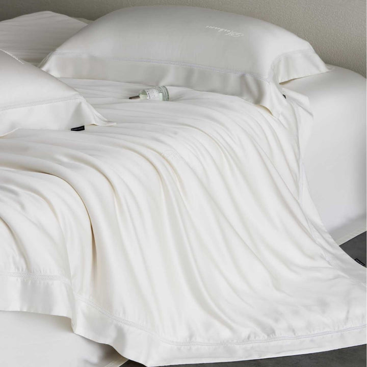 Silky-smooth cotton satin bedding set with fine decorative ribbon and pillowcases