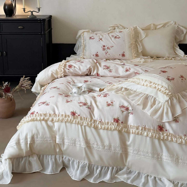 Luxury bedding set made of cotton satin with a ruffled bed skirt, lace trim, and quilted vintage blanket