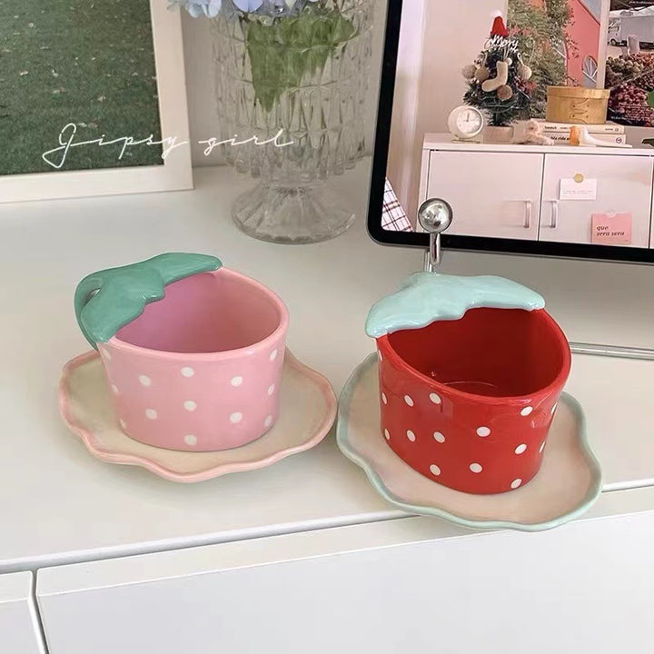 Playful ceramic mug with shaped leaf handle, saucer, and tulip spoon
