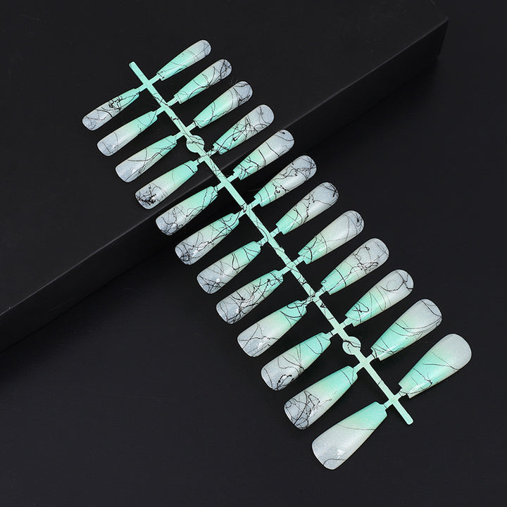 Artificial nails in modern ombre design with marbled accents Kalsten