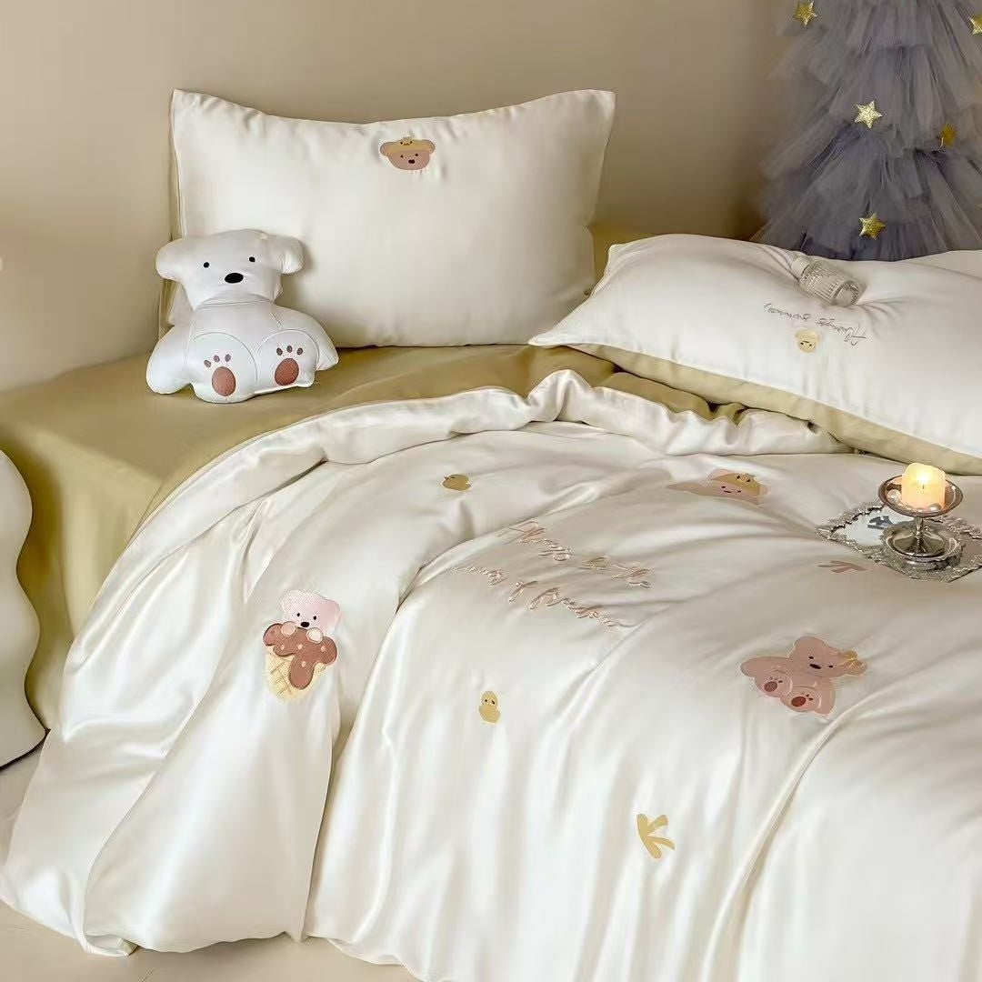 Luxurious satin bedding set with embroidered cherry motifs, reversible function and plush bunny pillow